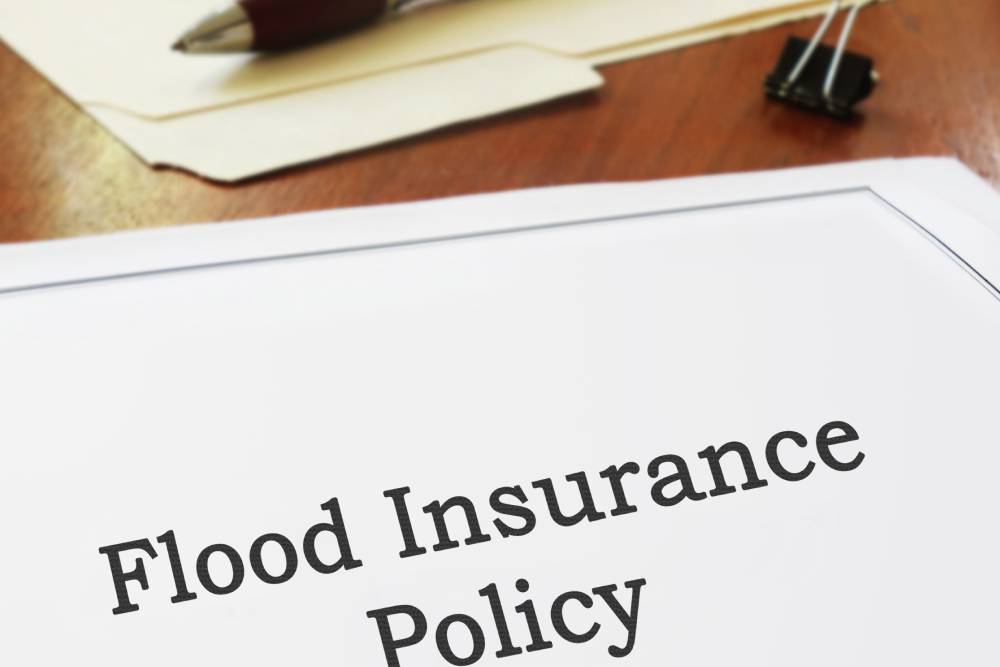 flood Insurance policy on an office desk