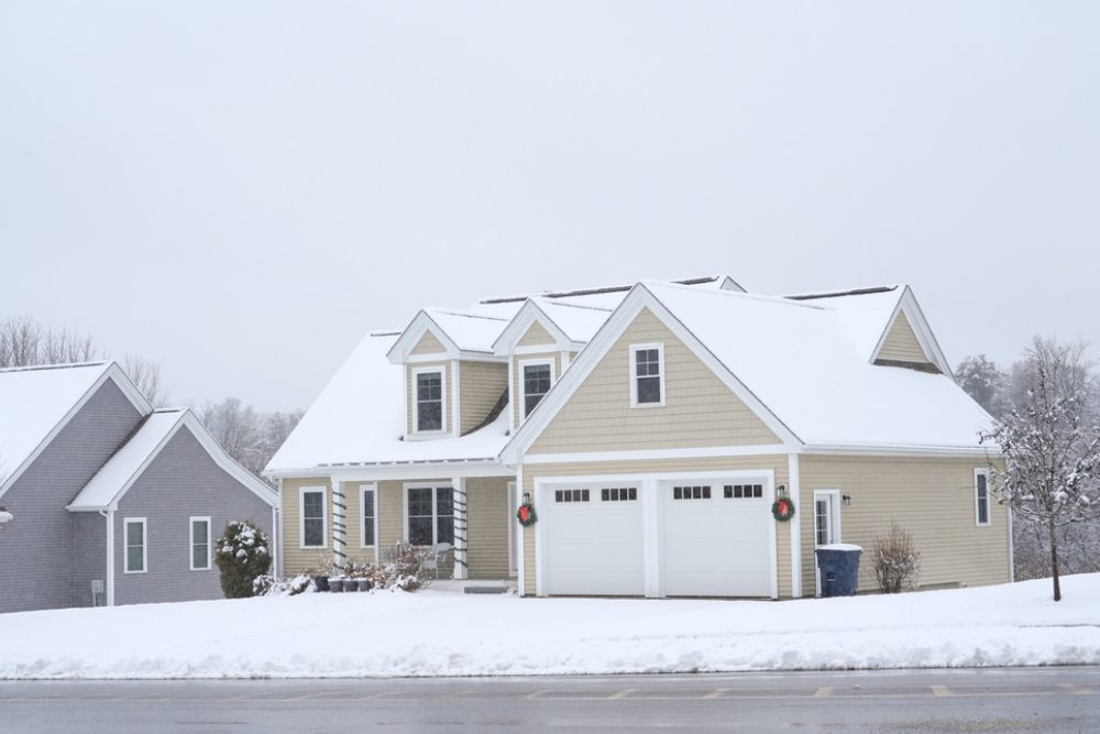 houses in residential community after snow in winter