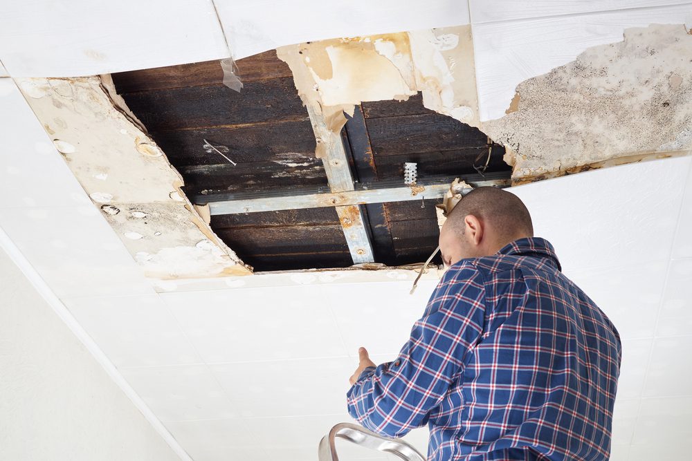 ceiling panels damaged huge hole in roof from rainwater leakage